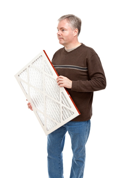 man holding air filter